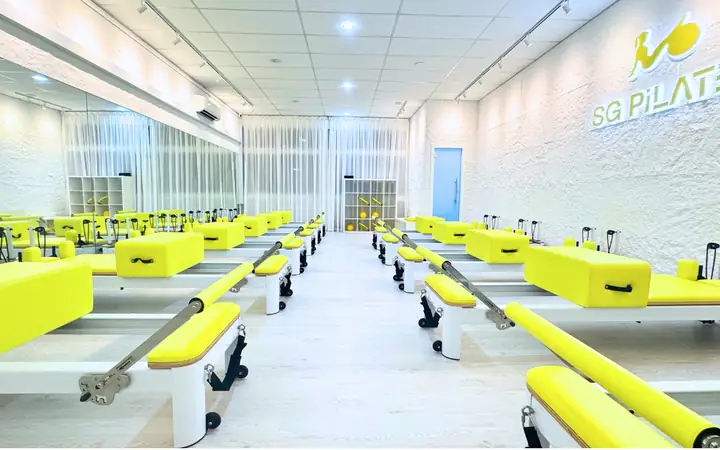 Lime-green reformers at SG Pilates Bukit Gombak