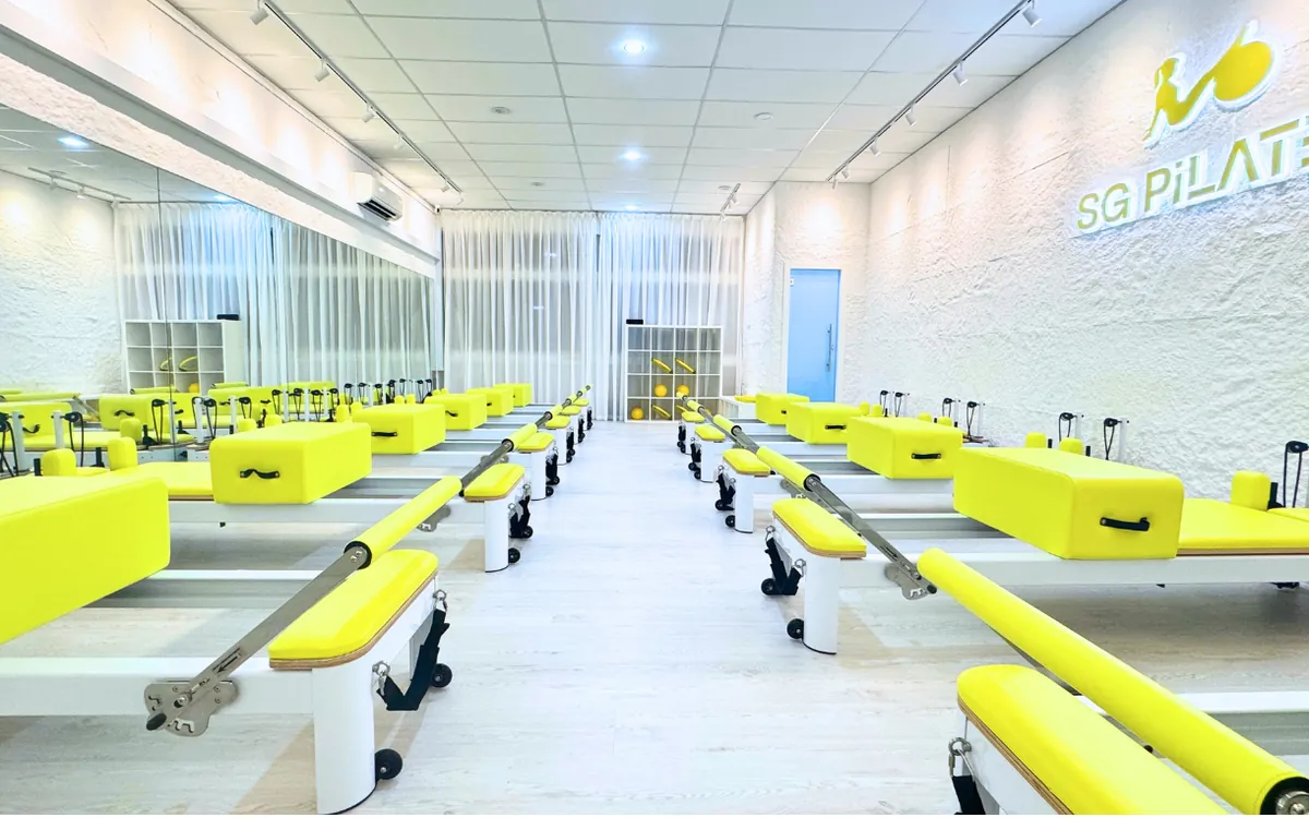 Lime-green reformers at SG Pilates Bukit Gombak